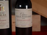 two bottles of wine sitting next to each other on a table