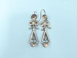 silver plated earrings with a pair of angels on them