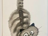 un tableau représentant un chat, accroché au mur