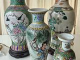 four vases that are sitting on a table