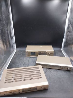 three laptops that are sitting in a clear box