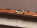 a close up of a piece of wood with a label on it