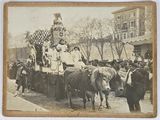 a vintage photo of a group of people riding on a horse