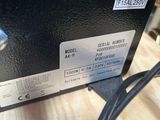 a close up of a power supply box on a wooden table