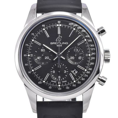 a close up of a watch with a black face and black leather strap