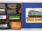 a box with a train set in it on a table