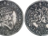 a close up of a coin with a crown on top of it