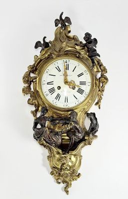 a clock that is hanging on the wall on the wall