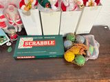 a box of scrabbles on a table next to a bag of candy