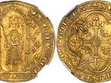 a gold coin with a cross on the front and a cross on the back