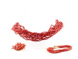 beaded red necklace and bracelet set on a white background