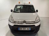 a small white van parked in a white room
