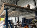 a picture of a garage with a ladder and a workbench