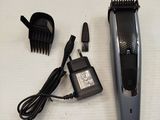 an image of a hair clipper and a comb on a table