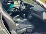 a picture of the inside of a car with the door open