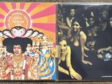 two cd ' s of jimi hendrix and the jimi hendrixs on a carpet