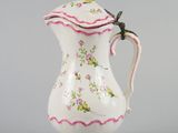 an image of a white and pink pitcher with a dragonfly on it