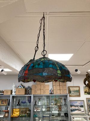 a lamp that is hanging from the ceiling in a room