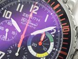 a close up of a wrist watch with a purple dial