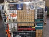 a metal cart with many boxes on it in a warehouse