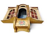 a small wooden box with a window on it