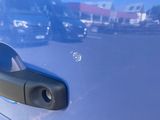 a reflection of a car in the side mirror of a car