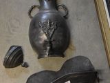 a picture of a wall with a vase and other items on it