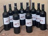 several bottles of wine sitting on top of a wooden barrel