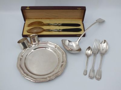 a silver plate with spoons and spoons in it