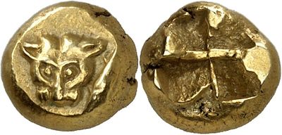 a close up of two gold coins with animals on them