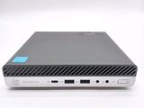 the back view of a laptop computer with a blue sticker on it