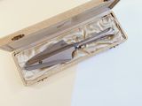 a knife and fork in a box on a table