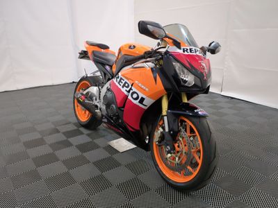 a motorcycle that is sitting on the floor in the room