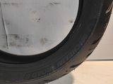 a close up of a tire on a white surface with a white background
