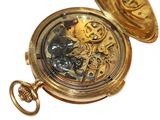 a gold pocket watch with a chain attached to it