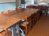tables and chairs in a room with tile flooring and tile flooring