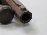 a close up of a piece of wood with a screw on it