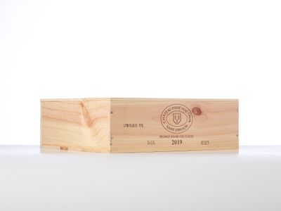 a close up of a wooden box on a white surface