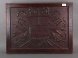 a wooden plaque with a picture of a ship on it