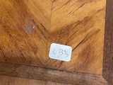 a sticker on the floor of a room with a wooden floor