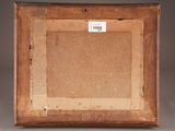 an old picture frame with a piece of paper taped around it