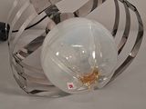 a metal cage with a light bulb inside of it