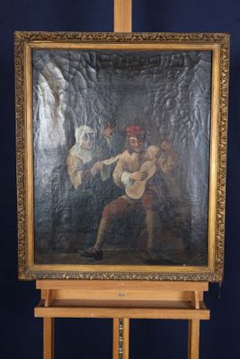 un vieux tableau représentant un homme tenant un chien, posé sur un chevalet en bois