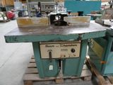 a machine that is sitting on a pallet in a warehouse