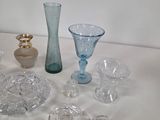 a lot of glass items sitting on a table
