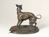 bronze statue of a greyhound dog on a base with a tag