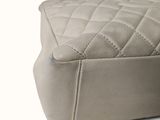 a close up view of a quilted mattress on a white surface