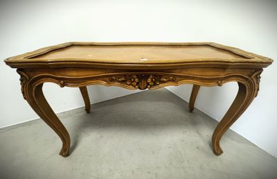 an image of a wooden table in a room with a white wall