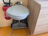 a small table with a fire extinguisher next to it