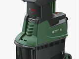 L'aspirateur vert et noir est posé sur un chariot.